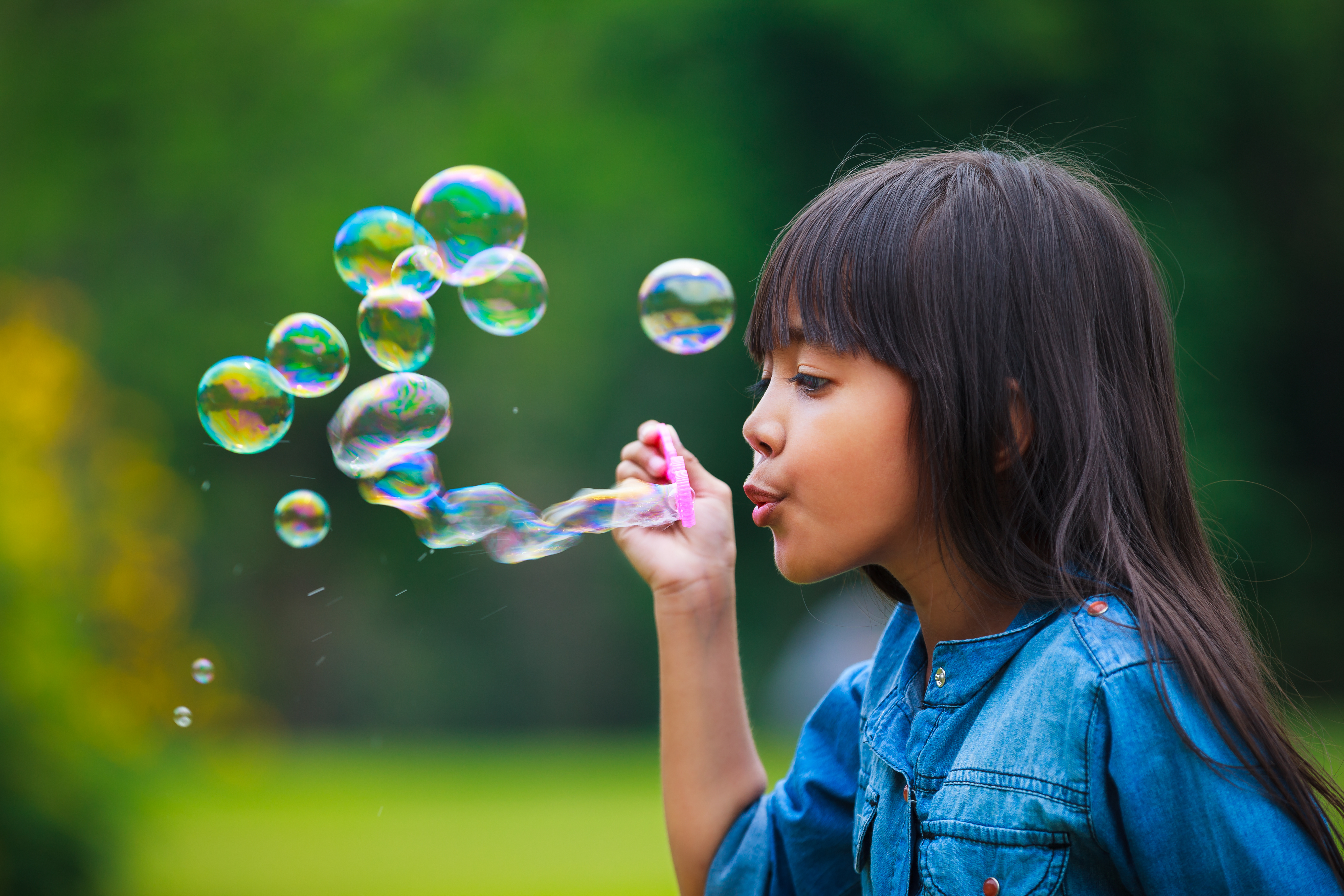 Girl blowing bubbles